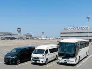 A selection of vehicles including 7-seater executive cars, 13-seater vans, and large coaches accommodating up to 49 passengers.